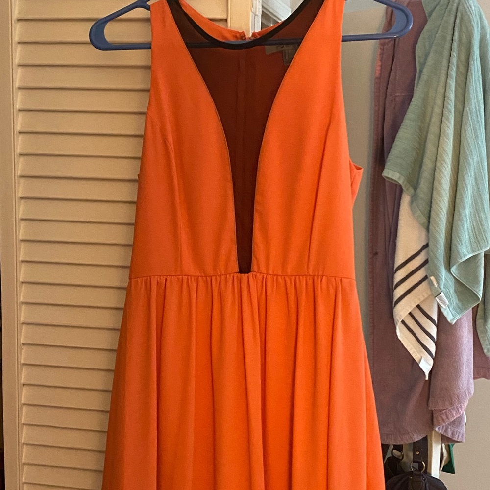 It’s a sleeveless dress with a little mesh on the top.